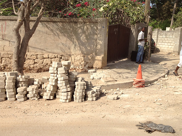 Fig. 3: Sidewalk pavers, containing recycled/repurposed demolition debris material from buildings damaged or destroyed by the 2010 earthquake. Photo by the author.